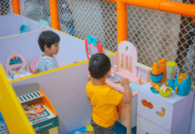 Which Toys Will Benefit Your Child’s Development? Two children at pretend play stations