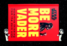 Learn To Rule Your Empire With “Be More Vader” A pair of LEGO stormtroopers carry a book called "Star Wars" "Be More Vader"