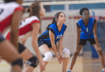 School Sports Injuries: Prevention & Treatment Tips A schoolgirl playing volleyball.