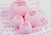 Bubble Gum Bath Bombs that Look Good Enough to Eat Four pink bubble gum bath bombs on a pink and white background.